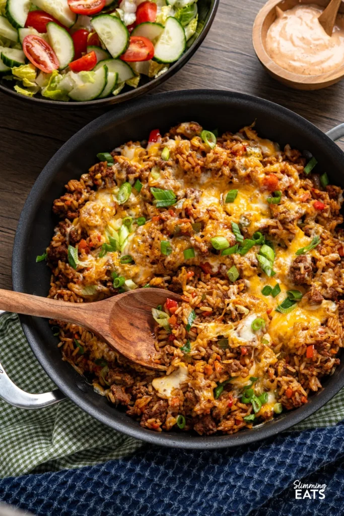 Cheesy Cajun Beef Rice in a pot with spices and cheese for a quick dinner